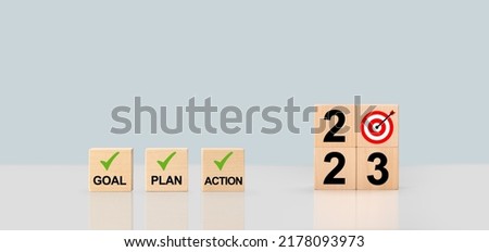 2023 Action Plan. Cubes with text 2023, plan, goal, action. to do list and plan for next year. wooden cubes with 2023, plan, goal, action. Development to success and motivation. Royalty-Free Stock Photo #2178093973