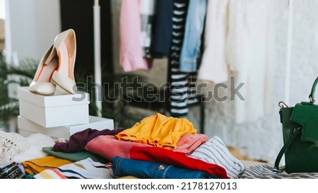 banner swap party for try on clothes, bags, shoes and accessories, friends change clothes, second hand and zero waste life, eco-friendly approach to consumption, clothes hanger in loft interior Royalty-Free Stock Photo #2178127013