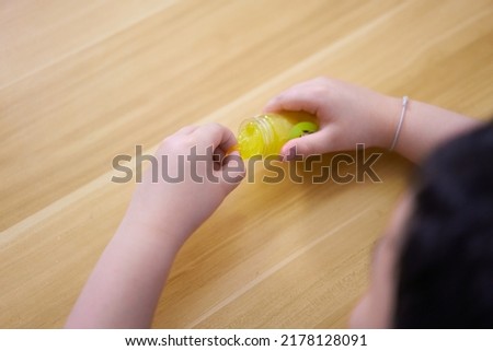 kid play slime on table