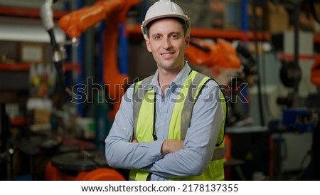 Engineer portrait, Portrait Manager engineer working with Robotic arms in factory. Engineer programming robotic operate production line manufacturing. Royalty-Free Stock Photo #2178137355