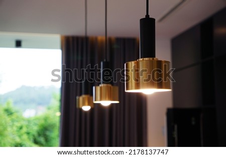 Hanging ceiling lights decoration for kitchen counter in a villa home                                Royalty-Free Stock Photo #2178137747