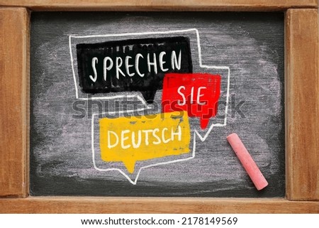 Chalkboard with text SPRECHEN SIE DEUTSCH? (DO YOU SPEAK GERMAN?) Royalty-Free Stock Photo #2178149569