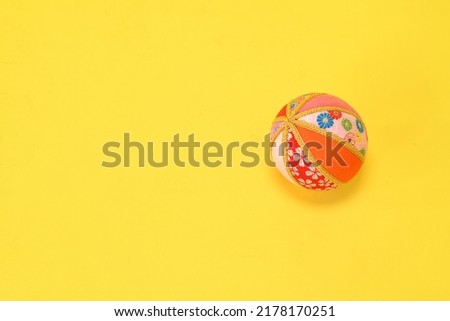Japanese pattern Temari placed on a yellow background