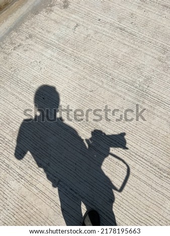photographer silhouette on the concrete floor