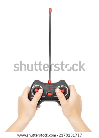 Hands holding a radio remote control. Joystick control. Royalty-Free Stock Photo #2178231717