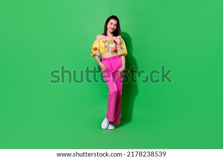 Full length photo of slender cheerful girl dressed off shoulders walking smiling isolated green color background