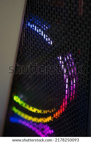 Computer case cooling fan with RGB lighting.