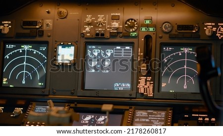 Airplane cockpit with flying command on control panel and dashboard for navigation, engine throttle and radar compass. Plane cabin with windscreen, buttons and handle. Close up. Royalty-Free Stock Photo #2178260817