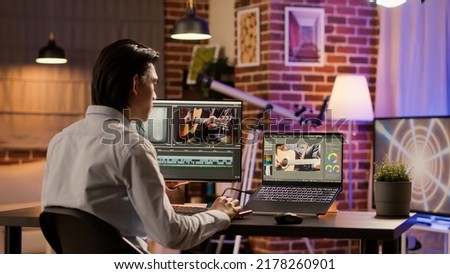 Media freelancer using film production software on computer to edit video content on app. Designing and editing with visual effects and color gradient to create movie. .