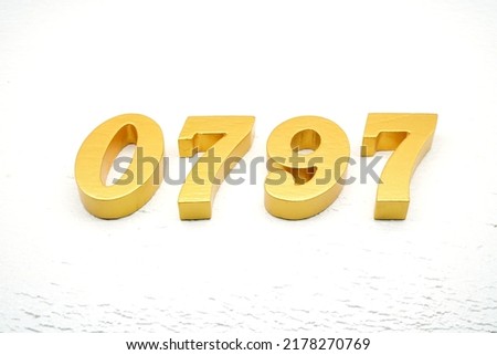     Number 0797 is made of gold painted teak, 1 cm thick, laid on a white painted aerated brick floor, visualized in 3D.                                          