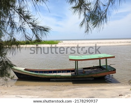 old canoe or boat by the river