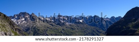 Beautiful wide angle mountain panorama at Swiss mountain pass Sustenpass on a sunny summer day. Photo taken July 13th, 2022, Susten Pass, Switzerland.
