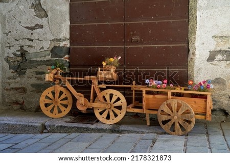 Bike made in wood with a cart