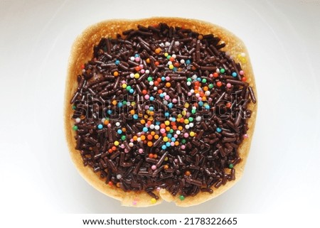 martabak mini. sweet cake with colorful toppings of chocolate and sprinkles on a white background