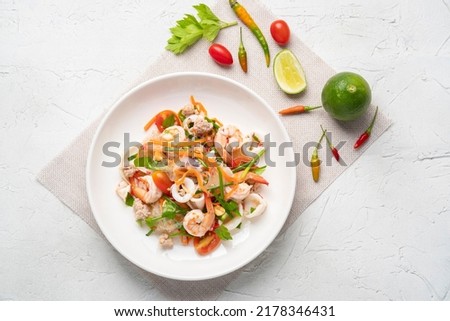 Spicy Glass Noodle Salad,mixed shrimp with minced pork and squid with boiled vermicelli in chili sauce(Yum Woon Sen).Top view Royalty-Free Stock Photo #2178346431