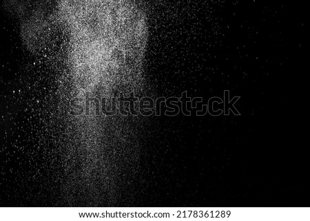 Abstract cloud with falling drops isolated on black background. White clouds, fog or smog moving on a black background. Drops of rain for overlay. Layout for your photo.
