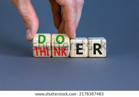 Doer or thinker symbol. Concept words Doer or thinker on wooden cubes. Businessman hand. Beautiful grey table grey background. Business and doer or thinker concept. Copy space. Royalty-Free Stock Photo #2178387483