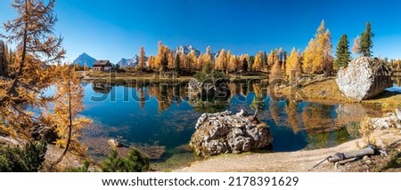 A beautiful lake in the autumn landscape. Autumn lake landscape. Autumn lake panorama. Autumn lake panoramic landscape Royalty-Free Stock Photo #2178391629