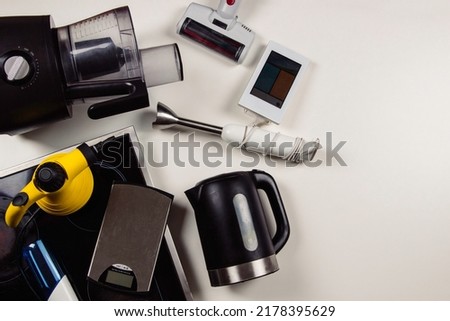 Old household, electrical appliances, broken hob, used electronic gadgets devices on white background. Planned obsolescence, electronic waste for recycling concept. Top view Royalty-Free Stock Photo #2178395629