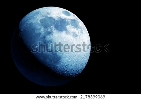 Moon in blue color, on a dark background. Elements of this image furnished by NASA. High quality photo