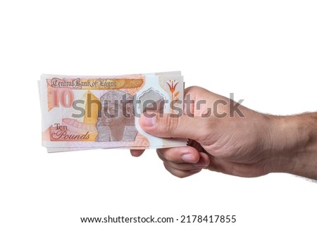 Egyptian Money, Man Paying, Paper Banknotes, Plastic New Ten Egyptian Pound, English Side Royalty-Free Stock Photo #2178417855
