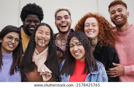 Group of multiethnic young people having fun outdoor while smiling on camera - Focus on the asian girl face Royalty-Free Stock Photo #2178425765