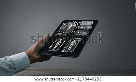 Doctor hand holding iPad, Medical infographic HUD. Health and healthcare and structure of human organs. Medical Infographic (Heart, brain mrt, lungs, stomach, kidney and human, healthy concept. Royalty-Free Stock Photo #2178440253