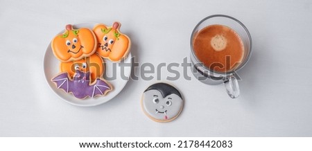 hot espresso coffee  or chocolate cup with funny Halloween Cookies. Happy Halloween day, Trick or Threat, Hello October, fall autumn, Traditional, party and holiday concept