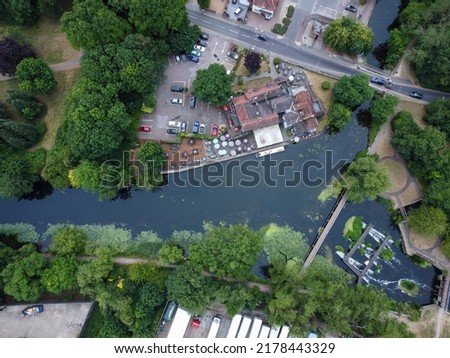 Downward drone shot of riversdie pub wwith clear water in Hoddesdon