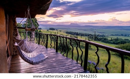 Drakensberg Giant Castle South Africa, Lodge in the mountains during sunset. beautiful lodge in a rock Royalty-Free Stock Photo #2178462355
