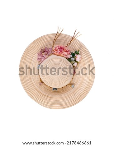 Closeup studio top view isolated shot of beautiful fashionable Asian modern classic style lady woman wicker woven weaving rattan handmade handicraft hat with dry flowers hatband on white background. Royalty-Free Stock Photo #2178466661