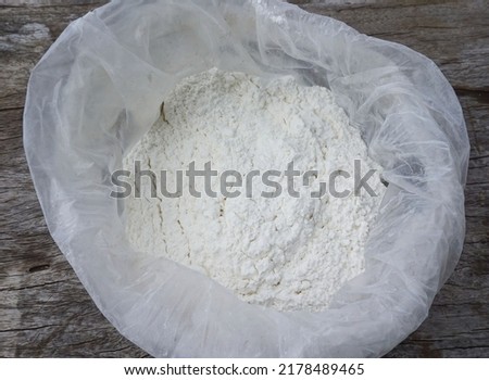 Lime in plastic bags is used as fertilizer to nourish trees planted in agricultural gardens. Royalty-Free Stock Photo #2178489465