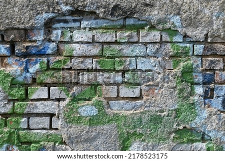 Smeared old, dilapidated brick wall