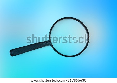 magnifying glass on colored background 