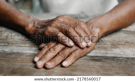 Close up of male wrinkled hands, old man is wearing
