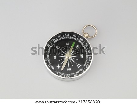 Compass on grey background. Find destination, travel and navigation concept.