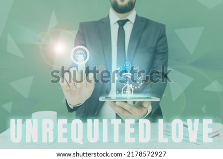 Hand writing sign Unrequited Love. Conceptual photo not openly reciprocated or understood as such by beloved Man holding Screen Of Mobile Phone Showing The Futuristic Technology.