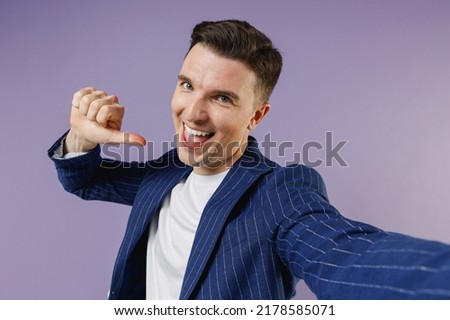 Close up confident young employee business man corporate lawyer 20s wears formal blue suit white t-shirt work in office point thumb fingers on himself isolated pastel purple background studio portrait