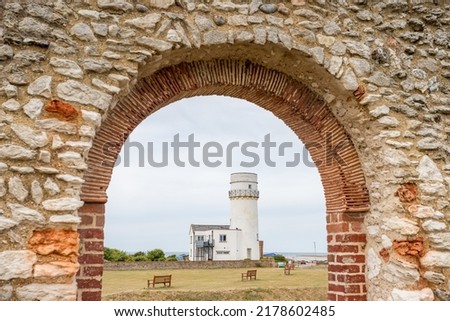 The ruins of St Edmunds Chapel frames the lighthouse at Hunstanton on the West Norfolk coast pictured in July 2022.