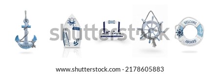 a set of isolated decorative souvenirs of a marine theme on a wh Royalty-Free Stock Photo #2178605883