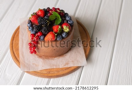 homemade cake with berries and strawberries
