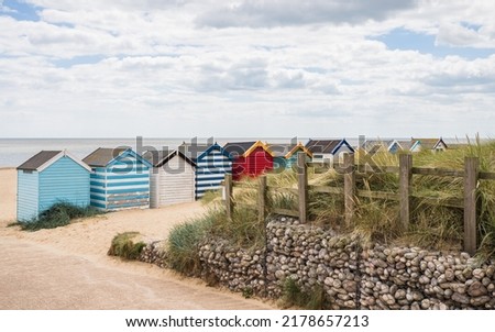 Pretty beach huts at Southwold pictured from behind on the Suffolk coast pictured in July 2022