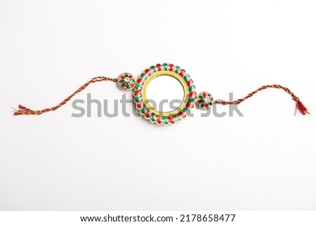 Indian festival: Raksha Bandhan. A traditional Indian wrist band which is a symbol of love between Brothers and Sisters. Royalty-Free Stock Photo #2178658477