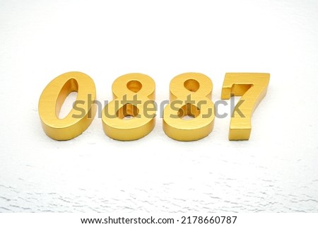   Number 0887 is made of gold painted teak, 1 cm thick, laid on a white painted aerated brick floor, visualized in 3D.                                