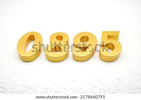     Number 0895 is made of gold painted teak, 1 cm thick, laid on a white painted aerated brick floor, visualized in 3D.                               