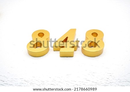   Number 848 is made of gold painted teak, 1 cm thick, laid on a white painted aerated brick floor, visualized in 3D.                                  