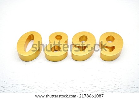   Number 0899 is made of gold painted teak, 1 cm thick, laid on a white painted aerated brick floor, visualized in 3D.                                