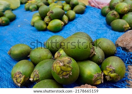 A collection of fresh betel nut sold in the local Indonesian market. Areca nut is usually chewed by traditional people                       Royalty-Free Stock Photo #2178665159