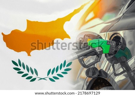 Car with a fuel injector on Cyprus flag background. Record prices fuel for population. Gasoline price increase during energy and fuel world crisis in Cyprus
