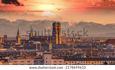 Sunrise over Munich Germany city, munich skyline aerial view in background pre alps mountains colored sky frauenkirche church cathedral marienplatz. Royalty-Free Stock Photo #2178699633